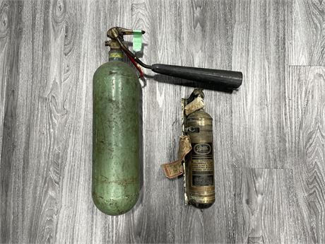 2 VINTAGE FIRE EXTINGUISHERS (GREEN ONE IS 22” LONG)