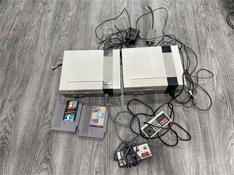 2 NES CONSOLES WITH 2 CONTROLLERS & 2 GAMES (POWERS ON)