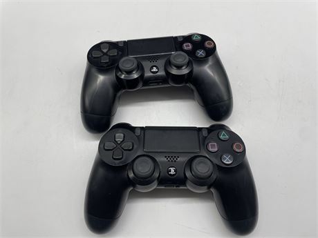 2 BLACK PS4 CONTROLLERS
