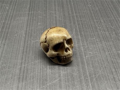 SMALL CARVED SKULL MADE OF BONE - HALF INCH