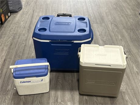 3 COLEMAN COOLERS - LARGE ONE (22” wide) HAS JAMMED HANDLE