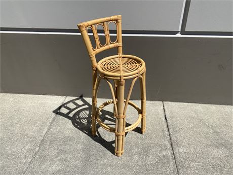 VINTAGE WHICKER CHAIR (41” tall)