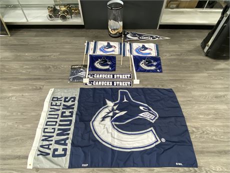 LOT OF NEW CANUCKS SIGNS, FLAGS, & PENNANTS (LARGEST IS 60”X34”)