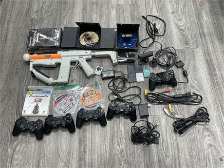PLAYSTATION LOT INCL: 2 PS2 CONSOLES W/ CORDS & CONTROLLERS, PS3 CONTROLLERS, &