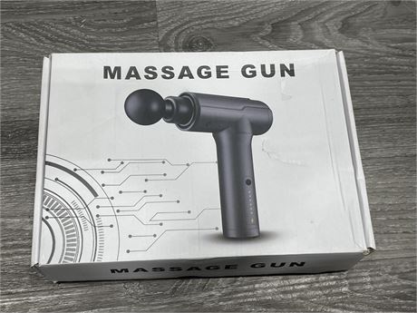 NEW IN BOX MASSAGE GUN