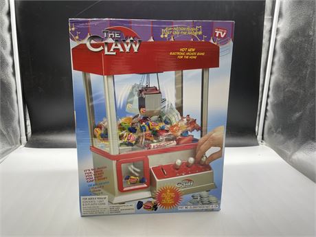AS NEW IN BOX THE CLAW