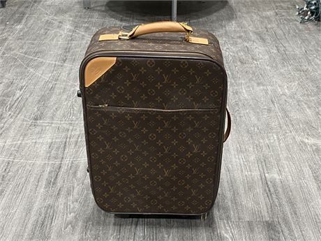LOUIS VUITTON SUITCASE UNAUTHENTICATED (15”X22”)
