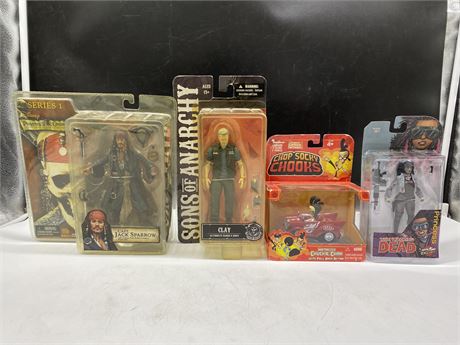 4 ASSORTED SEALED FIGURES INCL: PIRATES OF THD CARIBBEAN, WALKING DEAD, ETC