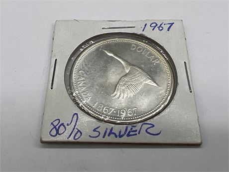 1967 CENTENNIAL “FLYING GOOSE” DOLLAR (.800 SILVER)