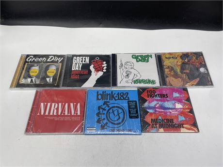 7 SEALED CD’S INCL: GREEN DAY, FOO FIGHTERS, BLINK-182, & NIRVANA