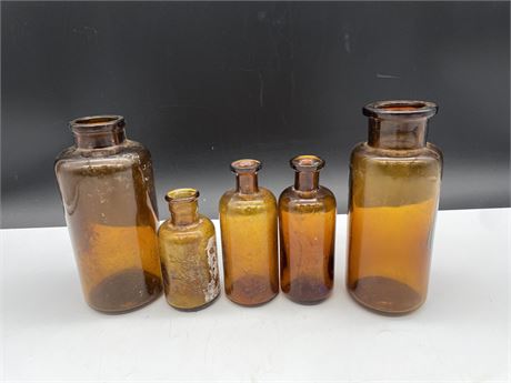 5 AMBER CIRCULAR BOTTLES 4”-7” EXCAVATED FROM 237 E.PENDER