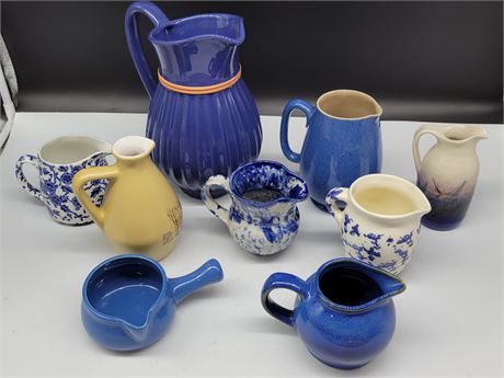 9 BLUE & WHITE PITCHERS ETC. (Some made in England)