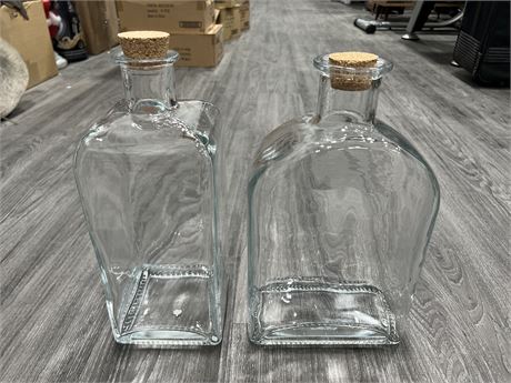 2 LARGE GLASS WHISKEY BOTTLES 15” TALL