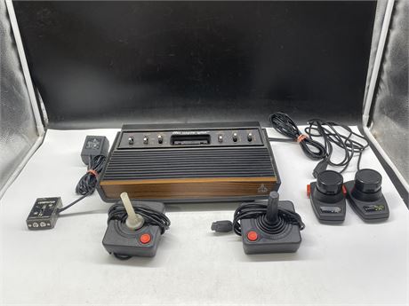 ATARI 2600 SYSTEM COMPLETE W/ CORDS & CONTROLLERS (UNTESTED)