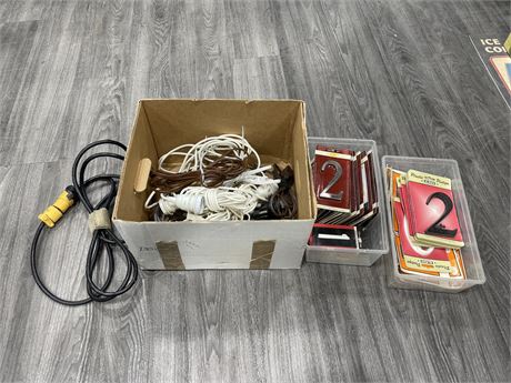 BOX OF ADRESS PLAQUE NUMBERS, EXTENSION CORDS & LIGHT CORDS