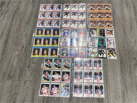 8 SHEETS OF ASSORTED ROOKIE CARDS-MOSTLY HOCKEY