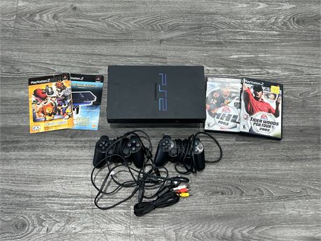 PS2 CONSOLE W/ 4 GAMES, AV, POWER CABLES & 2 CONTROLLERS