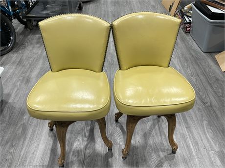 2 MCM HAND CARVED SWIVEL CHAIRS