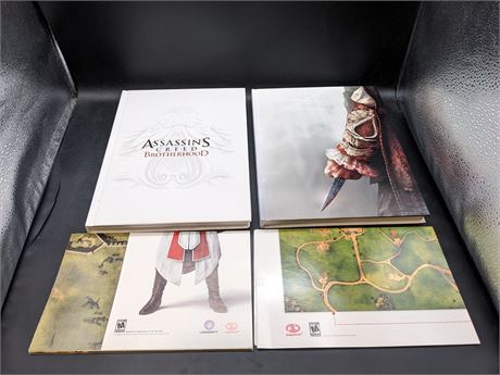 2 ASSASSINS CREED COLLECTORS EDITION HARDCOVER GUIDE BOOKS - EXCELLENT CONDITION
