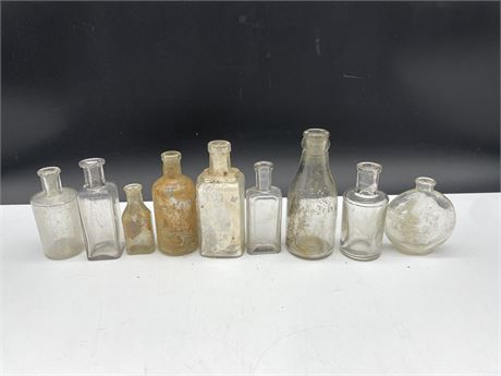 9 ASSORTED SIZE CLEAR MED. BOTTLES 5” EXCAVATED FROM 237 E.PENDER