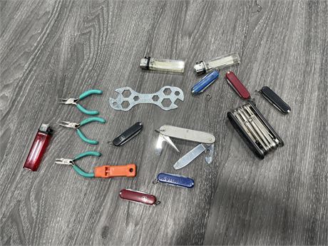 LOT OF TOOLS INCLUDING SWISS ARMY KNIVES, PLYERS, LIGHTERS, ETC