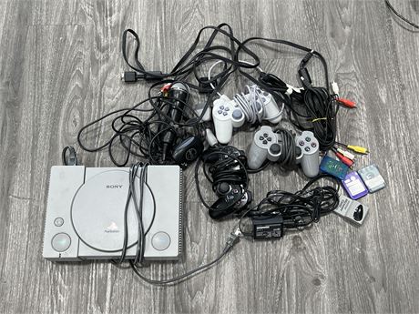 PLAYSTATION 1 CONSOLE W/ CONTROLLERS, CORDS & MEMORY CARDS