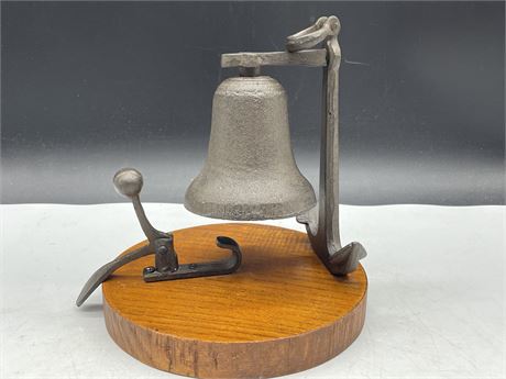 CAST IRON BELL ON WOOD PLAQUE 9”