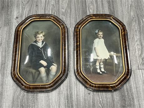 PAIR OF VINTAGE CHILDREN PORTRAITS FRAMED IN CONVEX GLASS 22X13”