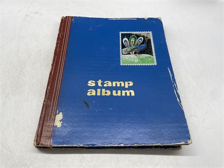 STAMP ALBUM WITH MANY STAMPS
