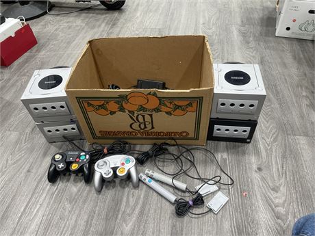 4 GAMECUBE CONSOLES W/ BOX OF POWER CORDS, MEMORY CARDS, & CONTROLLERS + LOOSE