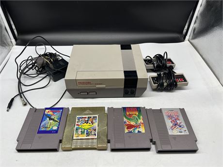 NES CONSOLE W/ 2 CONTROLLERS, CORDS & 4 GAMES