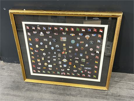 FRAMED COLLECTION OF PINS (25”x21”)