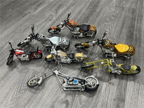 7 DIECAST MOTORCYCLE COLLECTABLES (Largest 12” long)