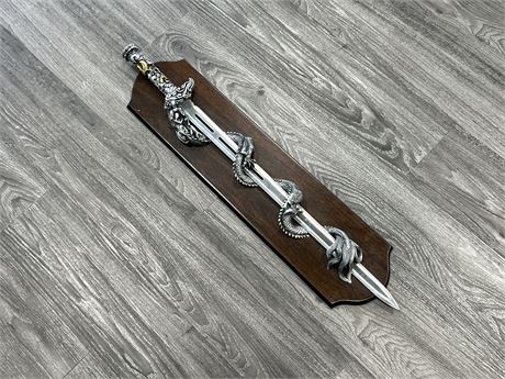 DECORATIVE STAINLESS STEEL SWORD IN WALL DISPLAY (33”)
