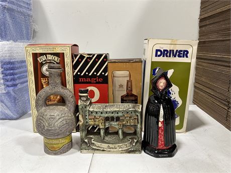 7 VINTAGE DECANTERS - 4 IN ORIGINAL BOXES - LARGEST IS 12”