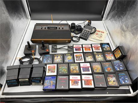 ATARI VIDEO COMPUTING SYSTEM W/ ACCESSORIES & MANY GAMES