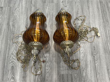 PAIR OF MCM ROOT BEER GLASS SWAG LAMPS - 22” LONG