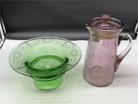 PURPLE GLASS LIDDED PITCHER & ELEVATED GREEN GLASS DISH (Pitcher is 10” tall)