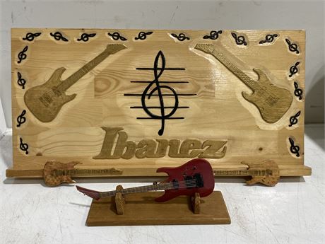 HAND CARVED IBANEZ GUITAR PLAQUE STAND (24”X12”) + CARVED GUITAR