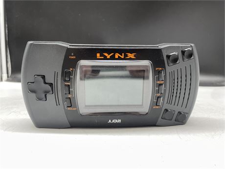 ATARI LYNX HAND HELD CONSOLE (WORKS) WITH ROADBLASTERS GAME CARD
