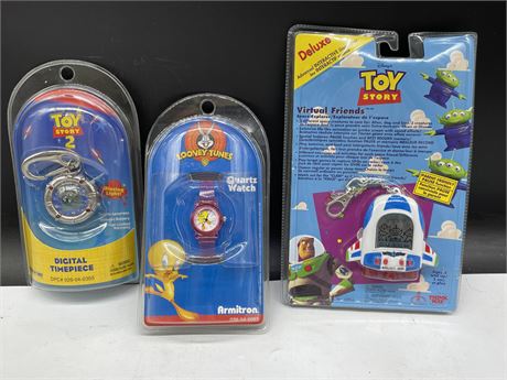 3 1990’S SEALED TOY STORY & LOONEY TUNES WATCHES/GAME