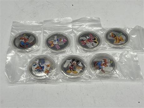 7 DISNEY SILVER PLATED COINS