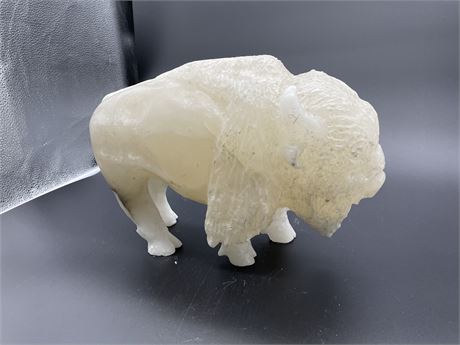 TRAVERTINE BISON 1ftx9” (SIGNED ON RIGHT HORN)