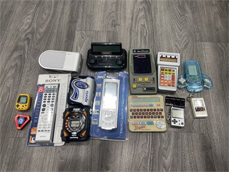 ASSORTED ELECTRONICS INCL: WALKMANS, PORTABLE GAMES, SEALED REMOTES,ETC UNTESTED