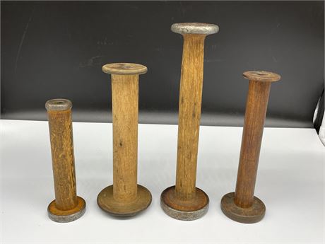 4 ANTIQUE WOOD SPOOLS (LARGEST IS 11” TALL)