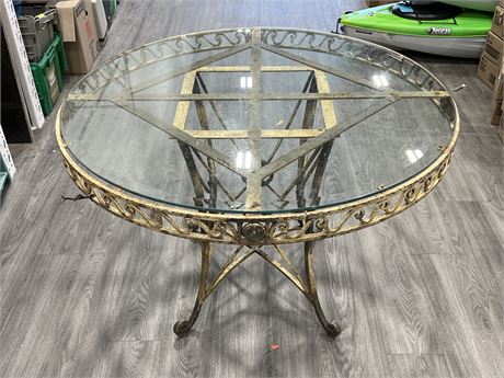 OUTDOOR IRON TABLE W/GLASS TOP (43” wide, 29” tall)