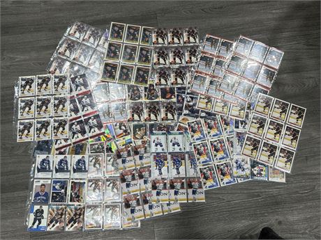 LARGE LOT OF SHEETS OF ASSORTED CANUCKS CARDS