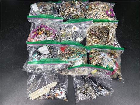 11 BAGS OF COSTUME JEWELRY