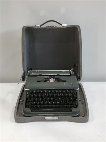 OLYMPIA ANTIQUE DELUXE TYPEWRITER WITH METAL CASE