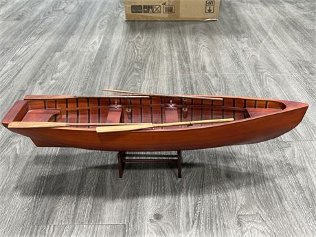 DECORATIVE WOODEN BOAT W/ ORES ON STAND - 24” WIDE